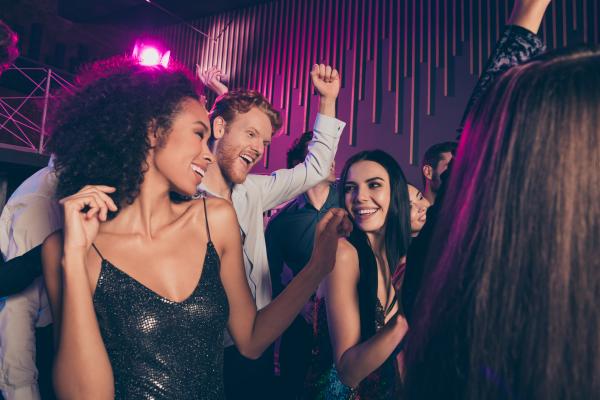 Couple at a club party meeting other swingers Couple at a club party meeting other swingers