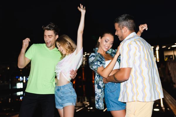 Two swinger couples having fun on a lifestyle cruise at night Two swinger couples having fun on a lifestyle cruise at night