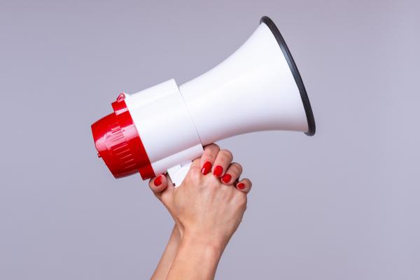 Woman holding megaphone Woman holding megaphone