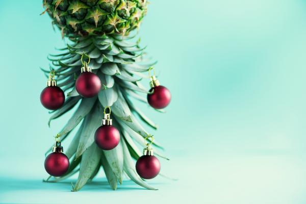 Upside-down pineapple decorated with Christmas ornaments Upside-down pineapple decorated with Christmas ornaments