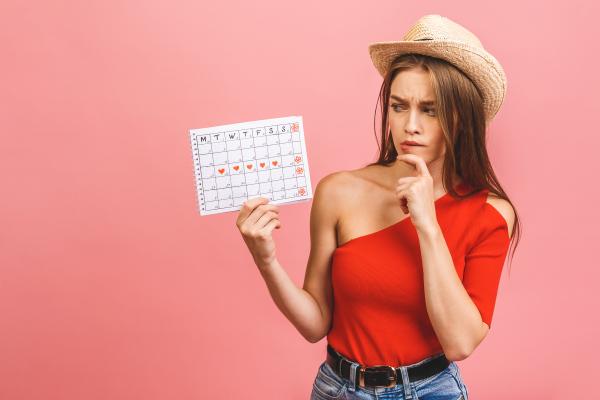 Concerned woman with her upcoming cycle schedule Concerned woman with her upcoming cycle schedule