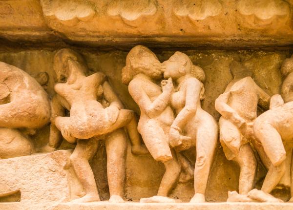 a photo of an erotic scene in stone carved sculptures on Khajuraho Temple India a photo of an erotic scene in stone carved sculptures on Khajuraho Temple India