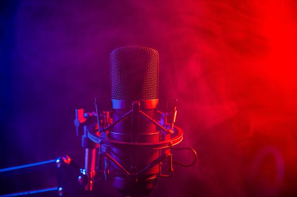 a photo of a professional microphone in thin smoke with purple and red lighting a photo of a professional microphone in thin smoke with purple and red lighting