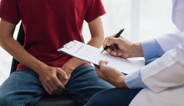 man seeking sexual health treatment with a doctor man seeking sexual health treatment with a doctor
