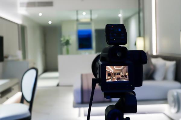 video camera on tripod in a hotel room video camera on tripod in a hotel room