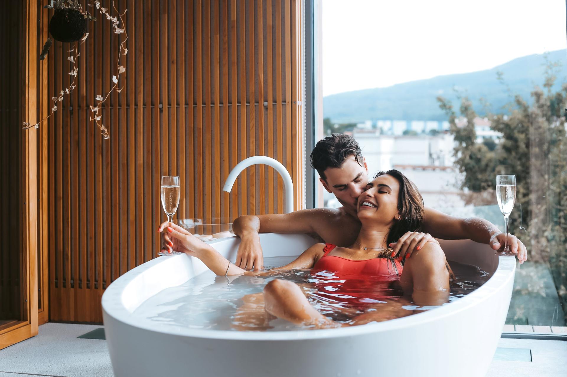couple enjoying a bath and champagne in a B&B