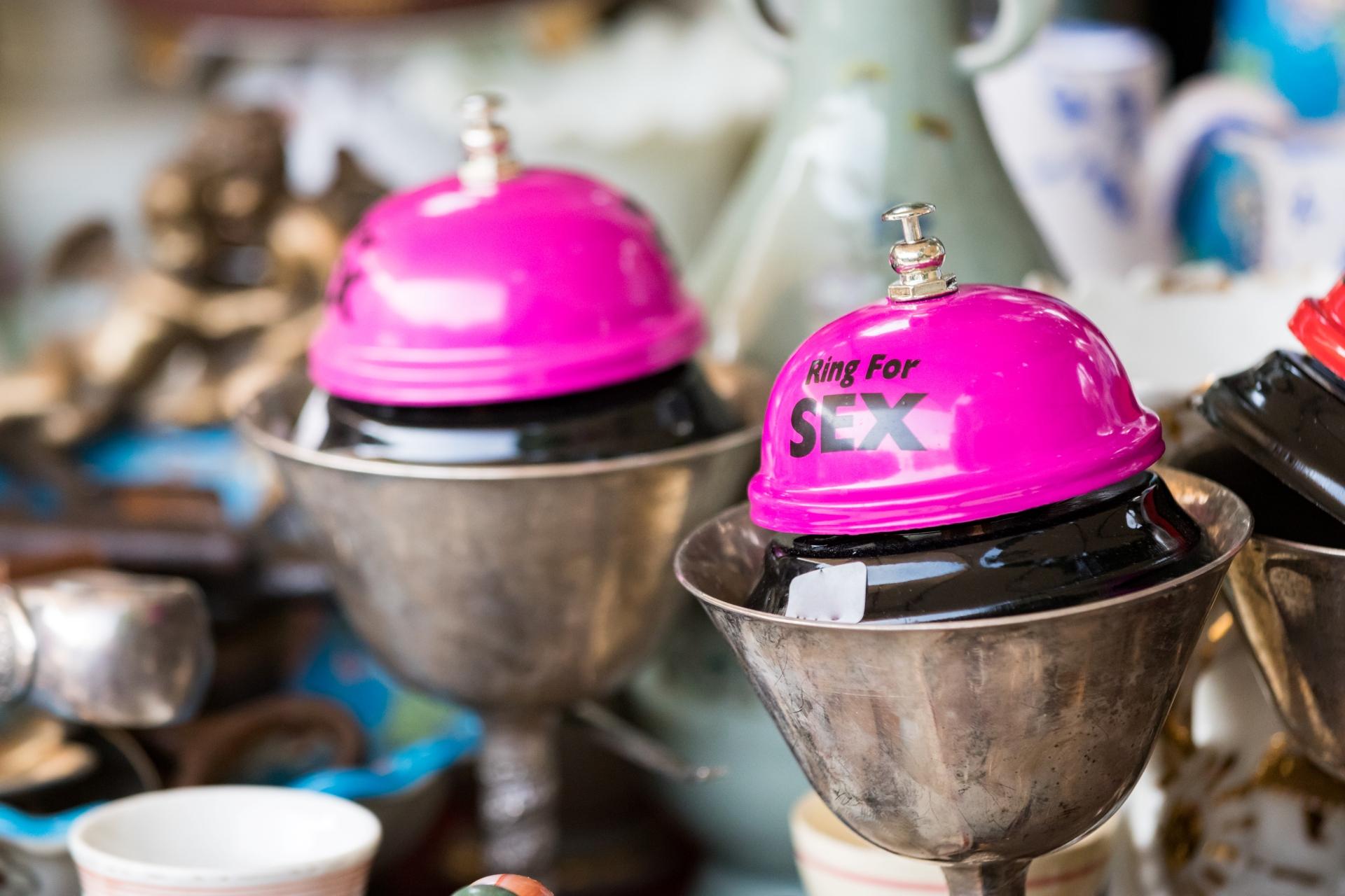 pink bells that read ring for sex in vintage metal cups