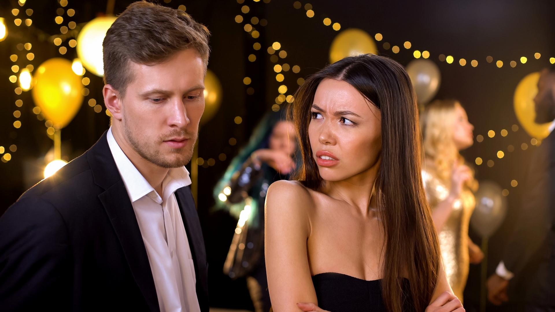 woman looking disappointed at her male partner