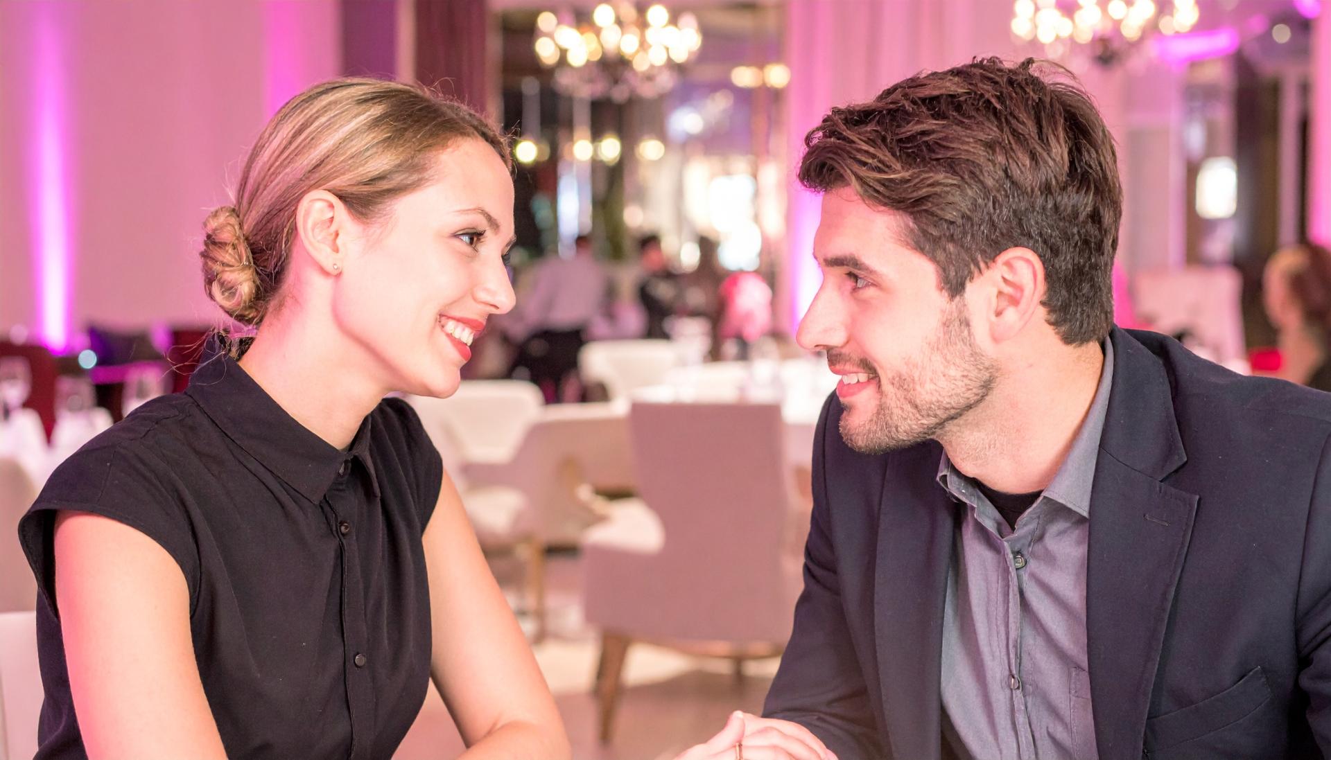 couple having a conversation at a lounge