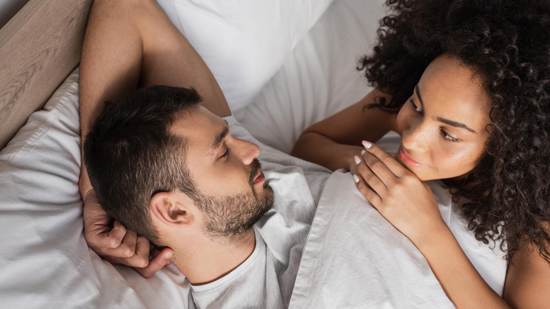 peaceful couple engaged in a tender moment in bed