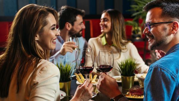Swingers on a double date at a restaurant Swingers on a double date at a restaurant
