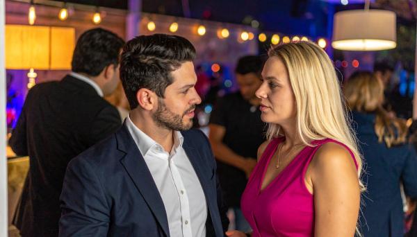 Couple talking at a party Couple talking at a party