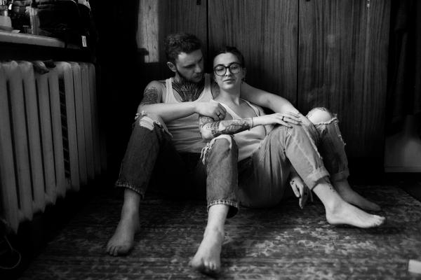 couple having an intimate conversation while sitting on the floor