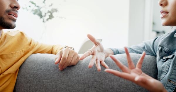 couple having a conversation using lively hand gestures