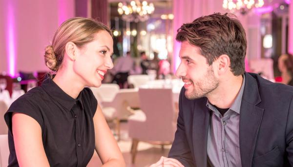 couple having a conversation at a lounge