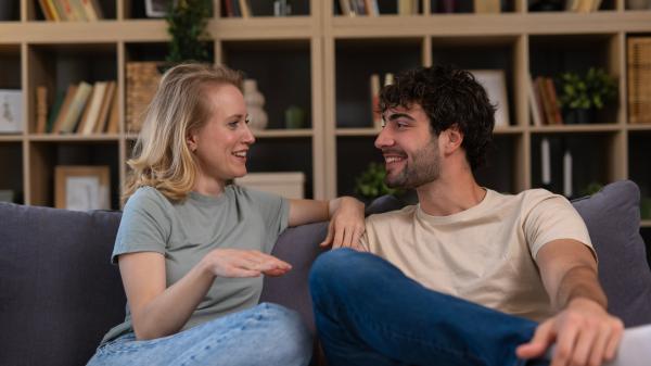 loving couple having a lively conversation on the couch