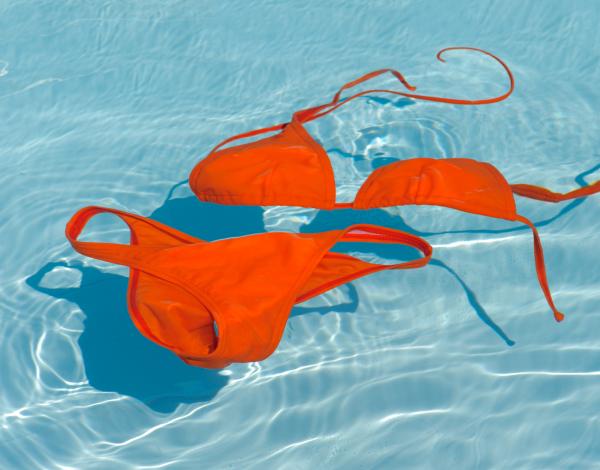 a two-piece bathing suit floating in a pool