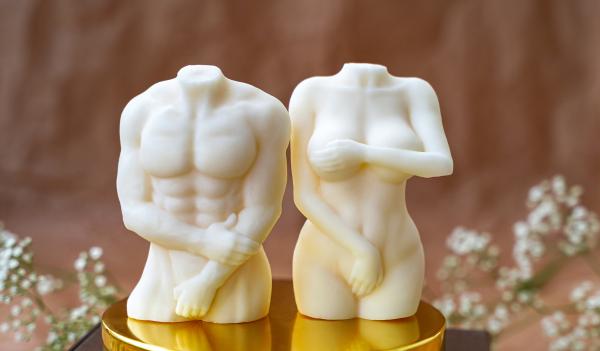 statues of a male and female body